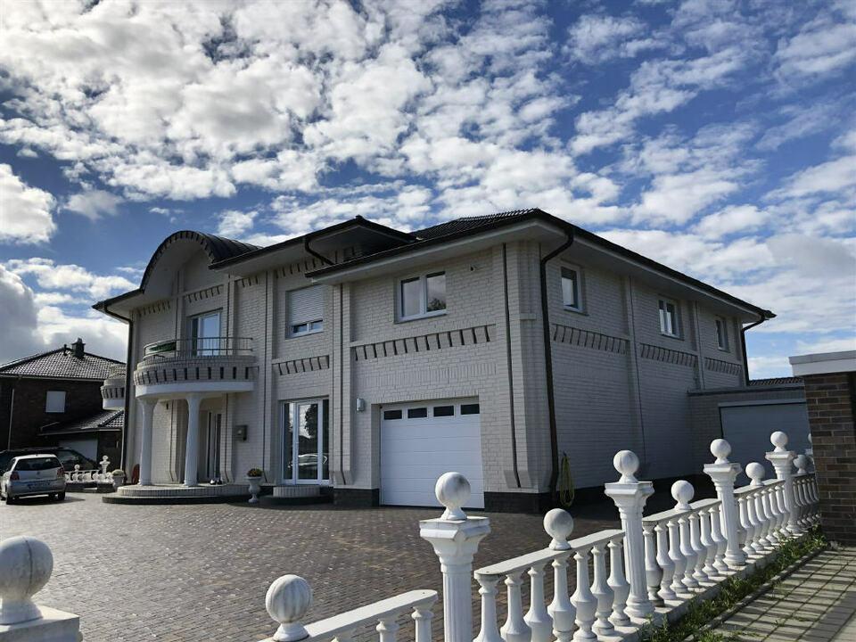Top-Immobilie in Ramsloh - Einfamilienhaus mit Gewerbeeinheit und Einliegerwohnung Saterland