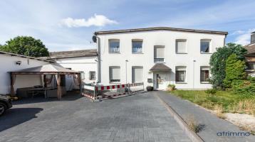 Vermietetes MFH mit vier Wohnungen, Büroeinheit, Dachterrasse und Garagen in Solingen