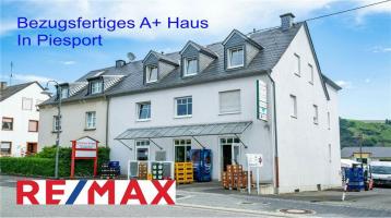 REMAX - Piesport offeriert A+-Gebäude mit vier bezugsfertigen Wohn- und Arbeitsebenen in der Bahnhofstraße 1
