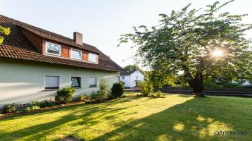 Schöner wohnen im Herzen von Westfalen: Zweifamilienhaus mit weitläufigem Gemeinschaftsgarten