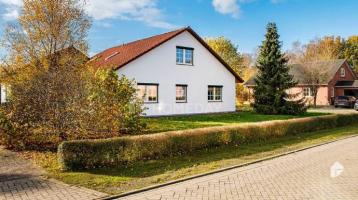 Großzügiges Einfamilienhaus mit Anbau, Garten und Garagen in Osterholz-Scharmbeck