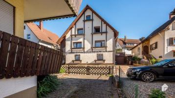Vermietetes Mehrfamilienhaus mit 4 Wohneinheiten, Balkonen und Garagen in Forbach