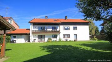 **4-Familienwohnhaus** mit Entwicklungspotenzial in ruhiger, sonniger Wohnlage in Waging am See!